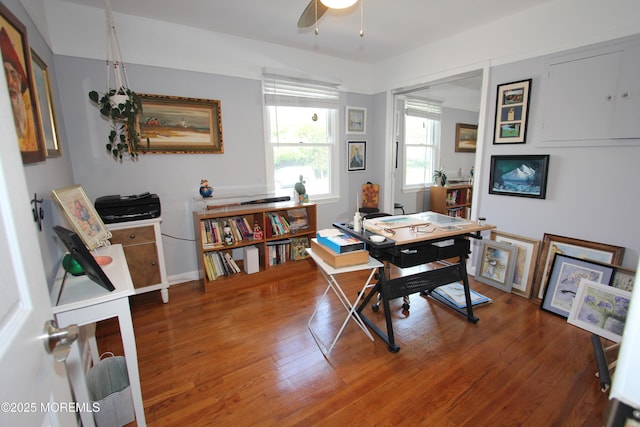 office area with ceiling fan and wood finished floors