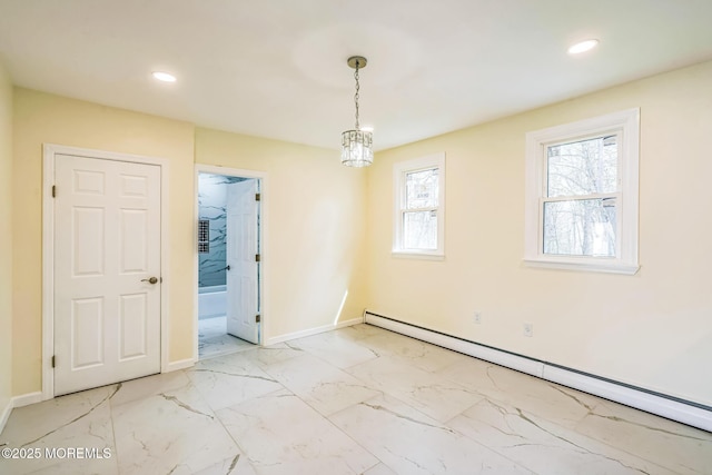 unfurnished dining area featuring marble finish floor, recessed lighting, baseboard heating, and baseboards