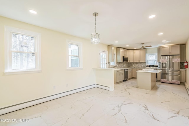 kitchen with decorative backsplash, stainless steel appliances, light countertops, baseboard heating, and recessed lighting