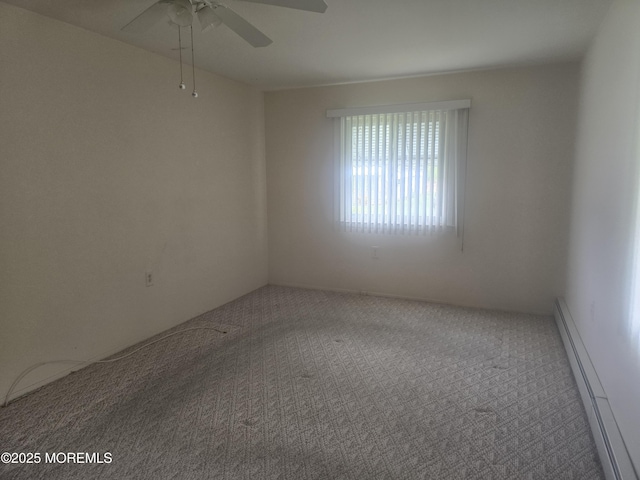 empty room with a ceiling fan, carpet flooring, and baseboard heating