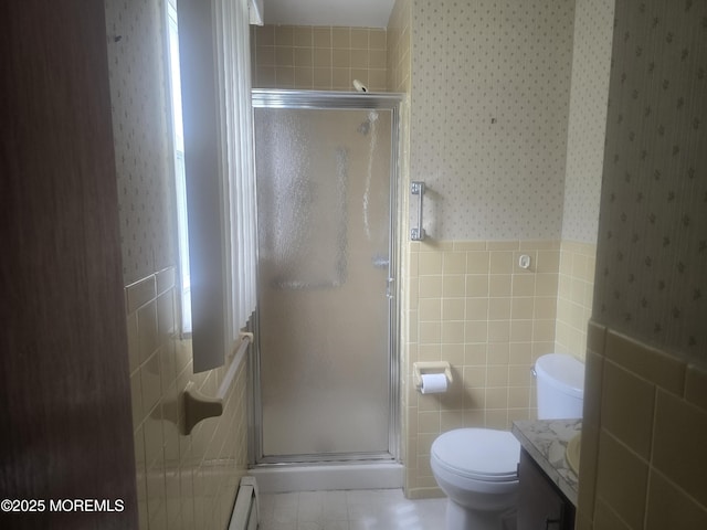 full bathroom with tile walls, wallpapered walls, a stall shower, and vanity