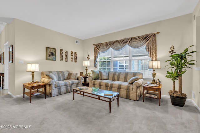 carpeted living room featuring baseboards and visible vents
