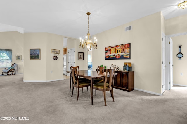 carpeted dining area with baseboards, a notable chandelier, and visible vents
