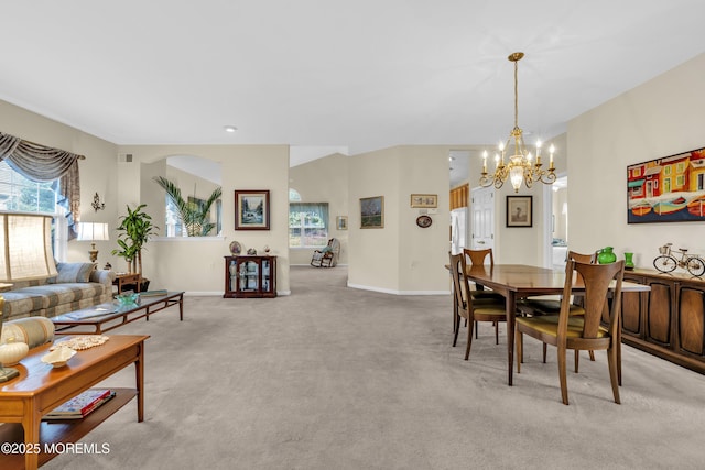 dining area with visible vents, baseboards, a notable chandelier, and light carpet