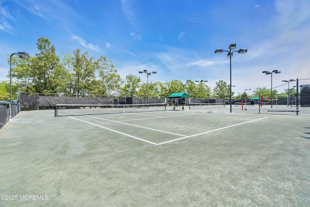 view of sport court with fence