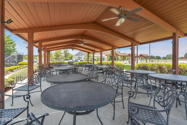 view of patio / terrace featuring a gazebo, outdoor dining space, and ceiling fan