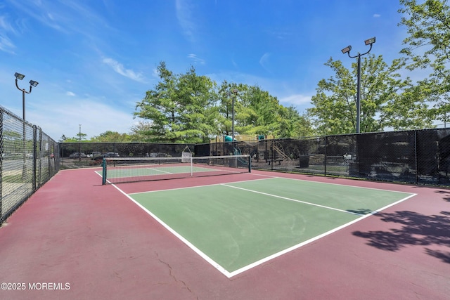 view of sport court featuring community basketball court and fence