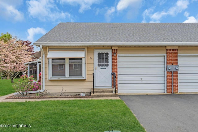 8A Lafayette Dr, Whiting, NJ 08759 - view of front of house featuring brick siding, roof with shingles, a front lawn, and aphalt driveway