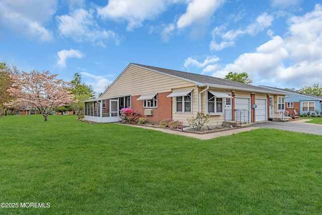 8A Lafayette Dr, Whiting, NJ 08759 - view of front facade featuring driveway, a sunroom, a front yard, and a garage