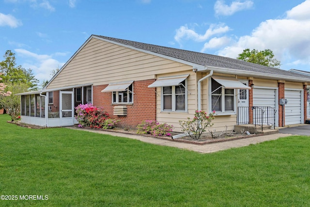8A Lafayette Dr, Whiting, NJ 08759 - rear view of property with a yard, driveway, brick siding, an attached garage, and a sunroom