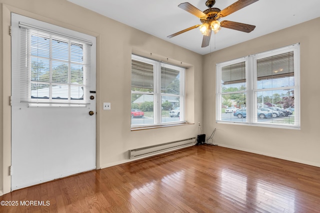 8A Lafayette Dr, Whiting, NJ 08759 - doorway featuring ceiling fan, plenty of natural light, hardwood / wood-style floors, and a baseboard heating unit