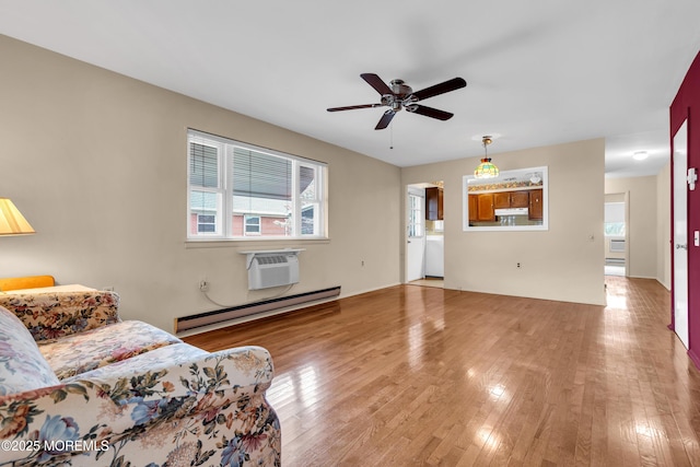 8A Lafayette Dr, Whiting, NJ 08759 - living room featuring a ceiling fan, wood finished floors, baseboard heating, and a wall mounted AC