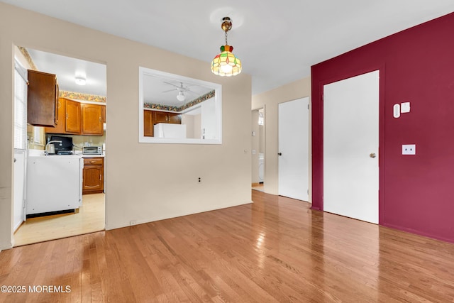 8A Lafayette Dr, Whiting, NJ 08759 - unfurnished dining area with a ceiling fan, a toaster, and light wood-type flooring