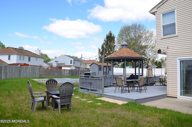 view of yard featuring a gazebo, a fenced backyard, and a deck