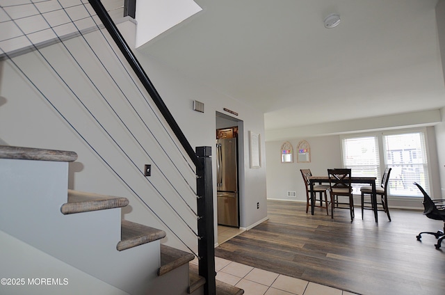 staircase featuring wood finished floors