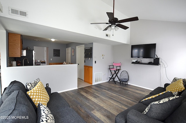 living room with visible vents, baseboards, ceiling fan, and wood finished floors