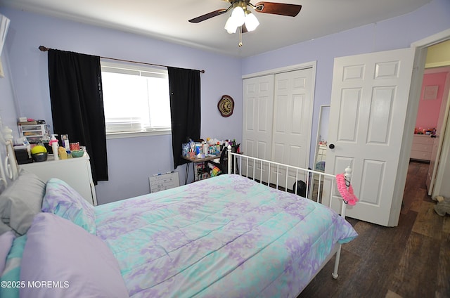 bedroom featuring a ceiling fan, wood finished floors, and a closet