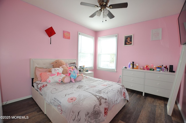 bedroom with baseboards, a ceiling fan, and wood finished floors