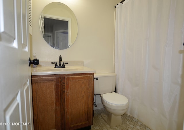 full bath with vanity, tile patterned floors, and toilet