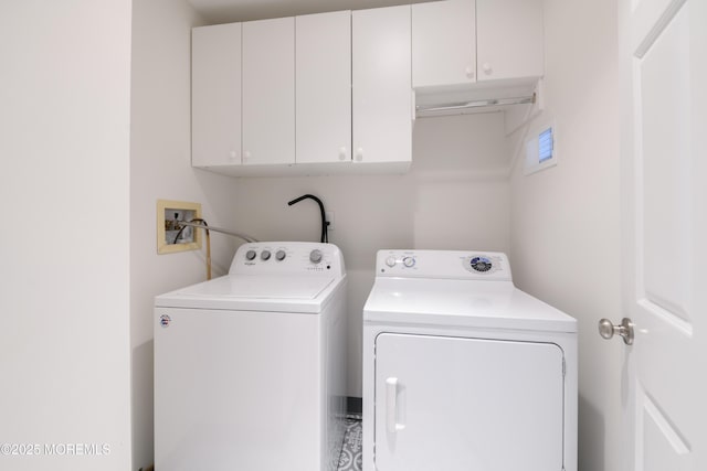 laundry room with cabinet space and independent washer and dryer