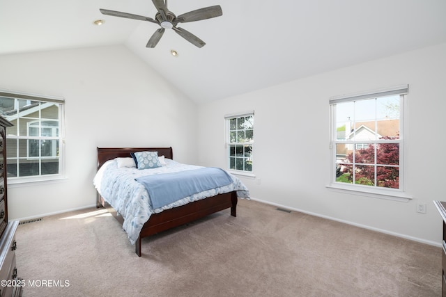 carpeted bedroom featuring a ceiling fan, visible vents, lofted ceiling, and baseboards