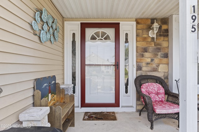 property entrance with stone siding
