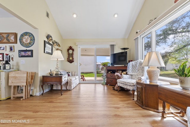 sitting room with visible vents, a healthy amount of sunlight, and light wood finished floors