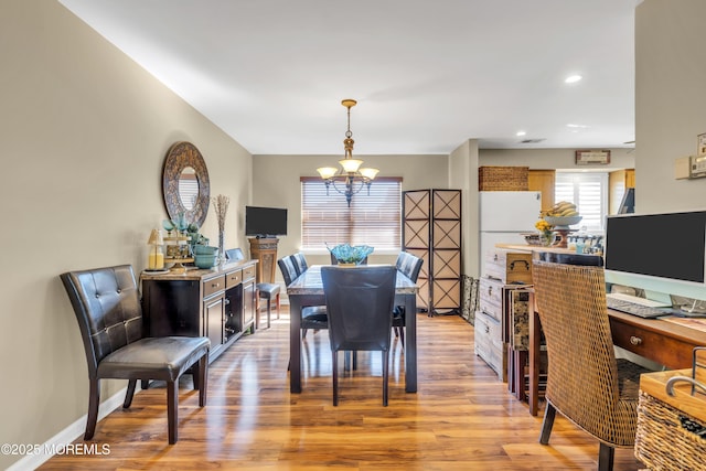 dining room with recessed lighting, baseboards, a chandelier, and light wood finished floors