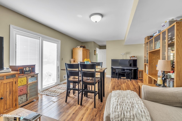 living room featuring light wood finished floors and a wealth of natural light