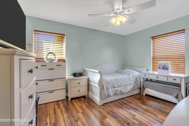 bedroom featuring a ceiling fan and wood finished floors