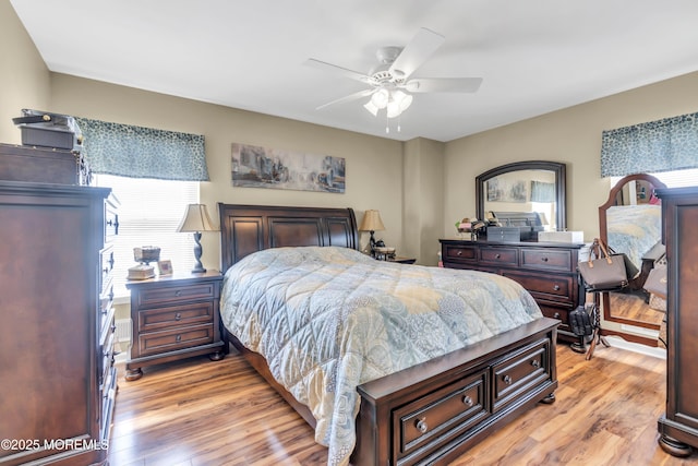 bedroom featuring a ceiling fan and light wood finished floors