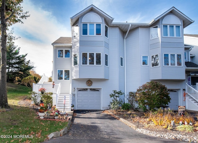 291 Marigold Ct, Toms River, NJ 08753 - view of front facade featuring a garage, driveway, and stairs