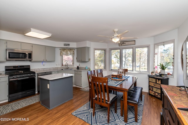 291 Marigold Ct, Toms River, NJ 08753 - kitchen with gray cabinetry, wood finished floors, appliances with stainless steel finishes, and a sink