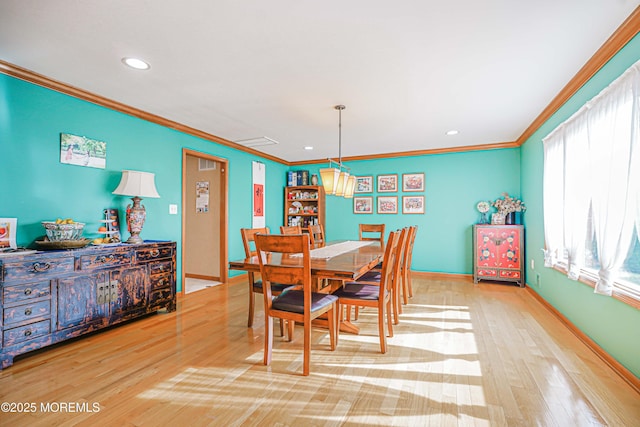 dining room featuring crown molding, baseboards, recessed lighting, and wood finished floors