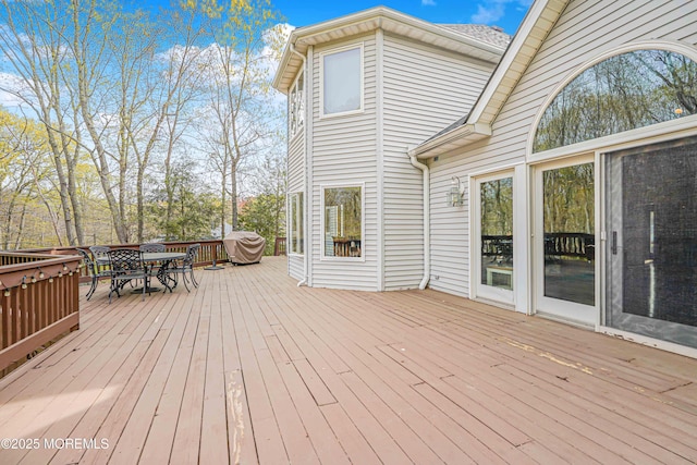 wooden deck featuring outdoor dining space