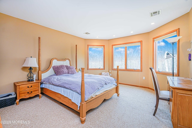 bedroom featuring recessed lighting, baseboards, light colored carpet, and visible vents