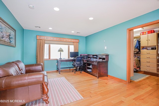 home office with recessed lighting, baseboards, visible vents, and light wood-type flooring