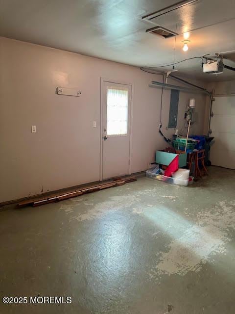 garage featuring a garage door opener