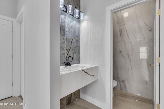 bathroom featuring toilet and vanity
