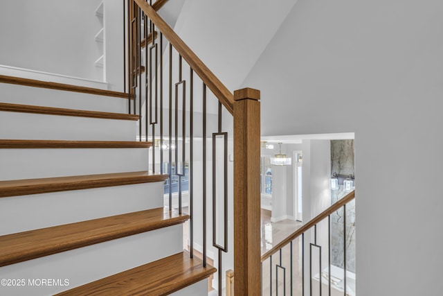 stairs featuring a high ceiling