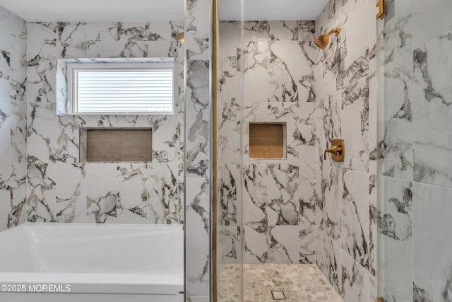 full bathroom featuring a tub and a stall shower
