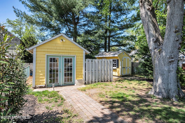 view of shed with fence