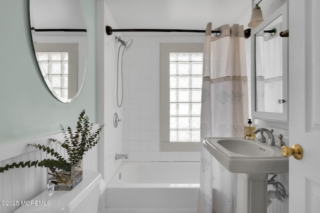 full bathroom featuring a wealth of natural light and shower / tub combo