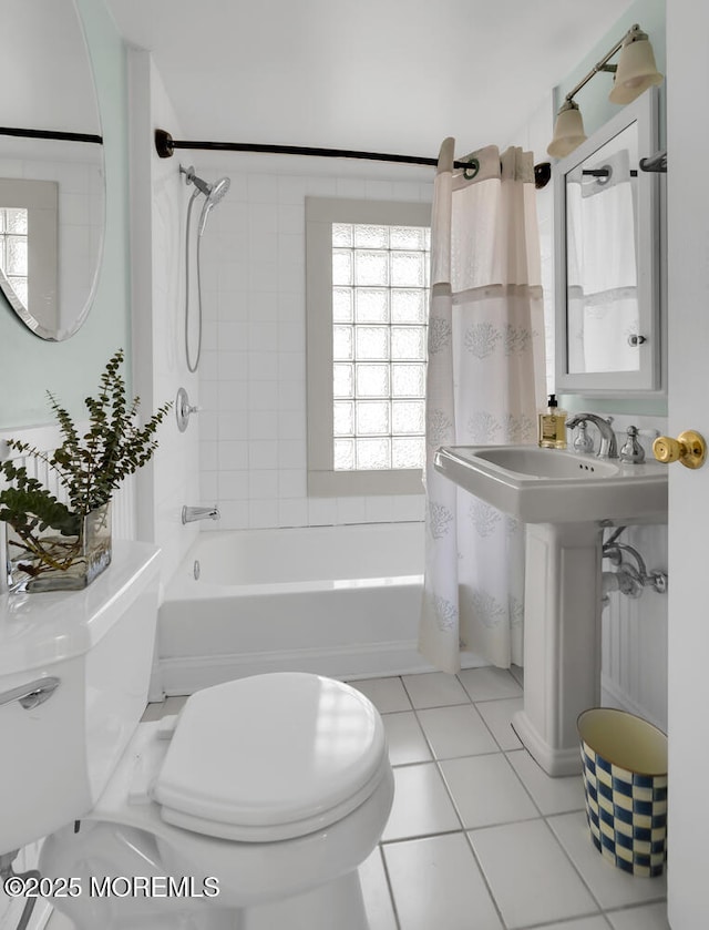 bathroom featuring tile patterned floors, shower / bathtub combination with curtain, and toilet