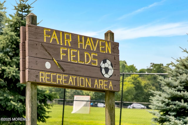 community sign with fence