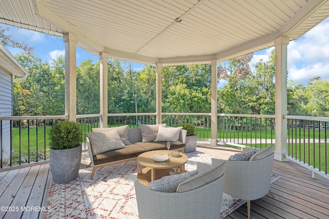 wooden terrace featuring an outdoor living space