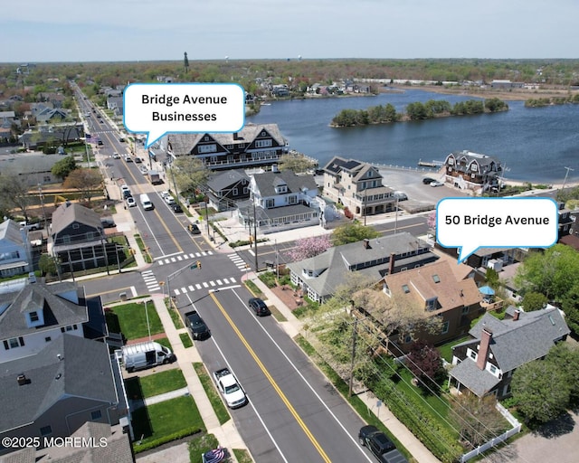 drone / aerial view featuring a water view