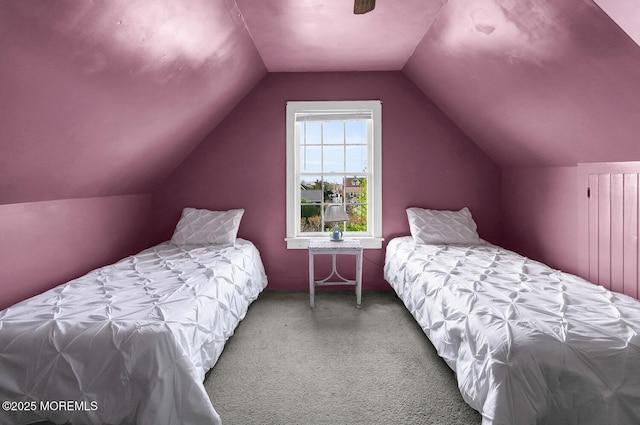 carpeted bedroom with lofted ceiling