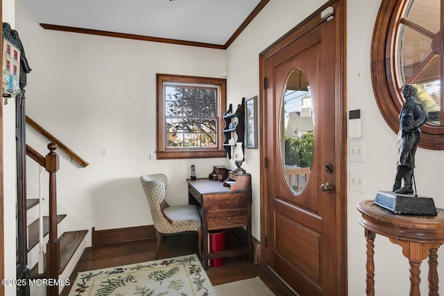 entryway featuring stairway, baseboards, ornamental molding, and wood finished floors