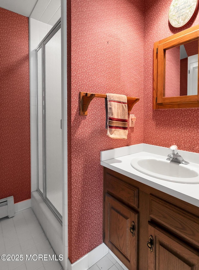 full bathroom featuring wallpapered walls, a shower stall, and tile patterned flooring